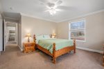 Indulge in Luxury by Unwinding in the Spacious Upper Level Master Suite, Featuring a Comforting Queen Bed